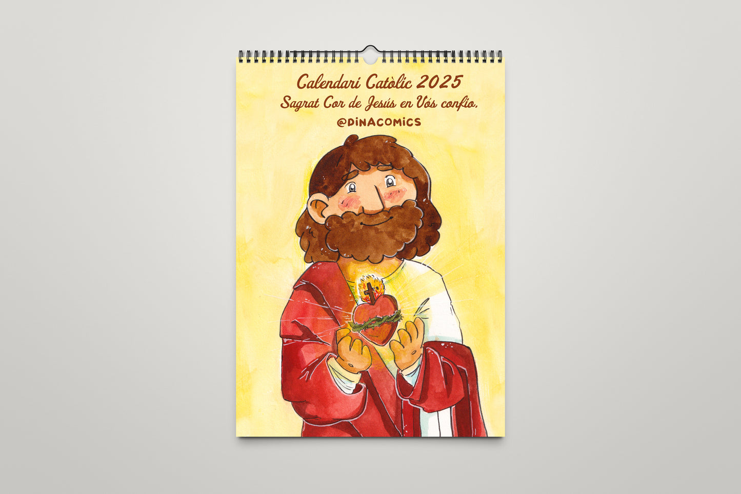 Calendario católico de pared 2025 dinacomics, 12 cómics (wall calendar)